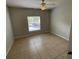 A bedroom with a ceiling fan and tile flooring at 5959 Westgate Dr # 1526, Orlando, FL 32835