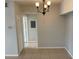 A dining room featuring a chandelier and tile floor at 5959 Westgate Dr # 1526, Orlando, FL 32835