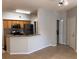 Kitchen with wood cabinets, granite countertops, and stainless steel appliances at 5959 Westgate Dr # 1526, Orlando, FL 32835