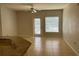Living room featuring tile flooring, neutral paint, and a sliding glass door to the outside at 5959 Westgate Dr # 1526, Orlando, FL 32835