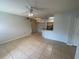 Spacious living room featuring tile floors, neutral paint, and views of the kitchen at 5959 Westgate Dr # 1526, Orlando, FL 32835