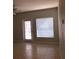 Bright living room with tile flooring, neutral paint, and access to other rooms at 5959 Westgate Dr # 1526, Orlando, FL 32835