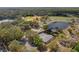 Aerial view showcasing the park's amenities, including tennis courts, a lake, and ball fields at 600 Northern Way # 502, Winter Springs, FL 32708