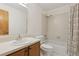 This bathroom features a tub-shower, a sink vanity, and a decorative shower curtain at 600 Northern Way # 502, Winter Springs, FL 32708