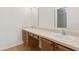 Bright bathroom featuring a double sink vanity and laminate floors at 600 Northern Way # 502, Winter Springs, FL 32708