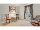 Bedroom with carpeted floors, comfortable seating, and window with outdoor views at 600 Northern Way # 502, Winter Springs, FL 32708