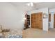Bedroom featuring laminate floors, a bookshelf, and bi-fold closet doors at 600 Northern Way # 502, Winter Springs, FL 32708