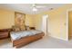 Bright bedroom with yellow walls, a platform bed, and built in end tables and lower drawers at 600 Northern Way # 502, Winter Springs, FL 32708