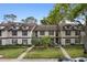 Townhouse exterior with symmetrical design, featuring balconies and lush landscaping at 600 Northern Way # 502, Winter Springs, FL 32708
