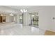 Sun-filled living space with mirrors, tile flooring, and balcony access at 600 Northern Way # 502, Winter Springs, FL 32708