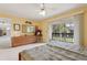 Inviting main bedroom with dresser, warm decor, and balcony access at 600 Northern Way # 502, Winter Springs, FL 32708