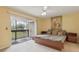 Relaxing main bedroom with balcony access and calming colors at 600 Northern Way # 502, Winter Springs, FL 32708