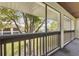 View from the covered patio overlooking green space with mature trees, providing privacy and shade at 600 Northern Way # 502, Winter Springs, FL 32708