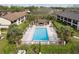 Overhead shot of the community pool showcasing many lounge chairs and sunbathing opportunities at 600 Northern Way # 502, Winter Springs, FL 32708