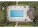 A lovely community pool area is shown from an aerial view and features plenty of lounge chairs at 600 Northern Way # 502, Winter Springs, FL 32708
