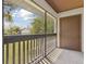 Screened porch with railing offers great views of the green lawn and blue sky at 600 Northern Way # 502, Winter Springs, FL 32708