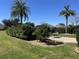 Nicely landscaped backyard with mature plantings, patio area, and stone border at 6832 Sw 93Rd Ave, Ocala, FL 34481