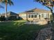 Lush backyard featuring a patio area, mature landscaping, and a cozy outdoor seating area at 6832 Sw 93Rd Ave, Ocala, FL 34481