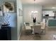 Cozy dining room with glass top table, seating for four, and bright natural light, adjacent to kitchen at 6832 Sw 93Rd Ave, Ocala, FL 34481