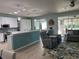 Open-concept living space with seamless flow to the kitchen and screened-in patio at 6832 Sw 93Rd Ave, Ocala, FL 34481