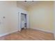 Bedroom with large closet and custom shelving with hardwood floors at 6936 Hochad Dr, Orlando, FL 32819