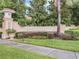 Stone monument at the entrance to The Vistas at Phillips Commons with manicured landscaping at 6936 Hochad Dr, Orlando, FL 32819
