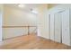 Second-floor hallway features hardwood floors and closet space at 6936 Hochad Dr, Orlando, FL 32819