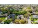 Aerial view of the property and neighboring homes in a mature setting at 701 Palenci Ct, Winter Springs, FL 32708