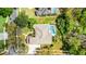 Aerial view of backyard pool and landscaping at 701 Palenci Ct, Winter Springs, FL 32708