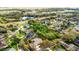 Aerial view of property surrounded by mature trees and lush landscaping at 701 Palenci Ct, Winter Springs, FL 32708