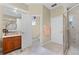 Well-lit bathroom with vanity, shower, and separate toilet area, offering functionality and style at 701 Palenci Ct, Winter Springs, FL 32708