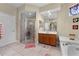 Functional bathroom featuring a glass-enclosed shower, vanity, and ample space for personal care at 701 Palenci Ct, Winter Springs, FL 32708