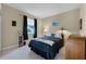 This cozy bedroom has a comfortable bed, bedside table with lamps, and a window for natural light at 701 Palenci Ct, Winter Springs, FL 32708