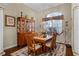 Elegant dining room with wooden furniture, decorative accents, and natural light at 701 Palenci Ct, Winter Springs, FL 32708