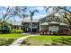 Charming home featuring lush landscaping, a brick walkway, and a well-maintained lawn at 701 Palenci Ct, Winter Springs, FL 32708
