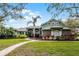 Charming home featuring lush landscaping, a brick walkway, and a well-maintained lawn at 701 Palenci Ct, Winter Springs, FL 32708