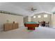 Spacious game room with pool table, barrel table and quaint decor at 701 Palenci Ct, Winter Springs, FL 32708