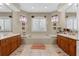 Luxurious main bathroom with double vanities, a soaking tub, decorative accents, and ample counter space at 701 Palenci Ct, Winter Springs, FL 32708