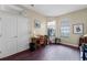 Bright office space with ample natural light and hardwood floors, perfect for working from home at 701 Palenci Ct, Winter Springs, FL 32708