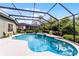 Screened pool with attached spa, fountain and surrounding greenery at 701 Palenci Ct, Winter Springs, FL 32708
