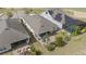 Aerial view of backyard area highlighting the patio, landscaping, and nearby golf course at 7977 Hanson Bay Pl, Kissimmee, FL 34747