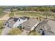 Aerial view of homes near a golf course, showcasing a community with lush greenery and a scenic backdrop at 7977 Hanson Bay Pl, Kissimmee, FL 34747