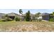 Well-maintained backyard with lawn, patio, shrubs and mature trees at 7977 Hanson Bay Pl, Kissimmee, FL 34747