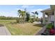 Lush backyard featuring beautiful landscaping, grass and a brick paver patio at 7977 Hanson Bay Pl, Kissimmee, FL 34747