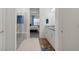 Contemporary bathroom with a glass shower and view into the bright bedroom at 7977 Hanson Bay Pl, Kissimmee, FL 34747