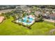Aerial view showcasing the community's pool area and clubhouse, highlighting resort-style amenities at 7977 Hanson Bay Pl, Kissimmee, FL 34747