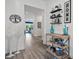 Inviting foyer with wood-look flooring, decorative accents, and an open floor plan at 7977 Hanson Bay Pl, Kissimmee, FL 34747