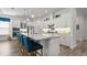 Well-equipped kitchen featuring expansive island with bar stools and stainless steel appliances at 7977 Hanson Bay Pl, Kissimmee, FL 34747