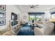 Inviting living room with a sliding glass door to the outdoors and comfortable seating for relaxing and entertaining at 7977 Hanson Bay Pl, Kissimmee, FL 34747