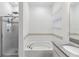 Clean bathroom featuring a bathtub, shower, granite countertop, and sink at 8255 Bryce Canyon Ave, Windermere, FL 34786